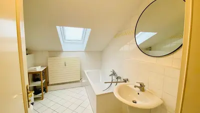 Ein Badezimmer in der Unterkunft Unglaublicher Seeblick I Sunset