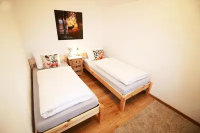 Ein Bett oder Betten in einem Zimmer der Unterkunft St Lukas Apartments