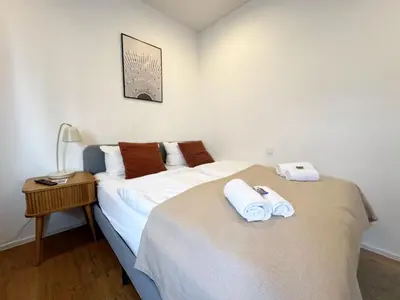 Ein Bett oder Betten in einem Zimmer der Unterkunft ma suite - smart apartment 2P - city Center