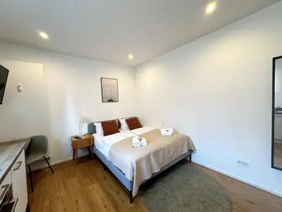 Ein Bett oder Betten in einem Zimmer der Unterkunft ma suite - smart apartment 2P - city Center
