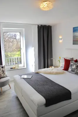 Ein Bett oder Betten in einem Zimmer der Unterkunft Living Concept Bogenhausen