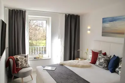 Ein Bett oder Betten in einem Zimmer der Unterkunft Living Concept Bogenhausen