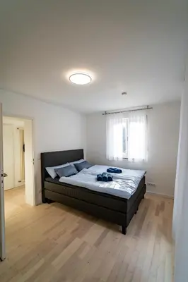 Ein Bett oder Betten in einem Zimmer der Unterkunft Ferienwohnung am Starnberger See