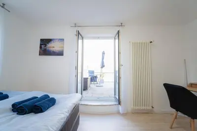 Ein Bett oder Betten in einem Zimmer der Unterkunft Ferienwohnung am Starnberger See
