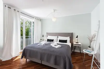 Ein Bett oder Betten in einem Zimmer der Unterkunft Blueberry Living - Design Loft nahe München - Dachterrasse - S-Bahn