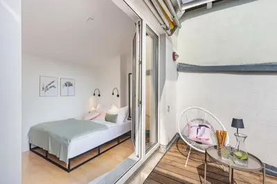 Ein Bett oder Betten in einem Zimmer der Unterkunft Blueberry Living - Design Loft nahe München - Dachterrasse - S-Bahn
