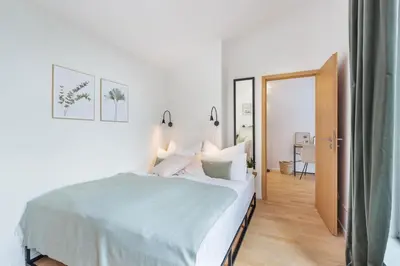 Ein Bett oder Betten in einem Zimmer der Unterkunft Blueberry Living - Design Loft nahe München - Dachterrasse - S-Bahn