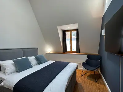 Ein Bett oder Betten in einem Zimmer der Unterkunft TRULY - Viel Platz für Business & Familie - Modern, Garage, Fahrstuhl