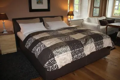 Ein Bett oder Betten in einem Zimmer der Unterkunft Gästehaus Nicole