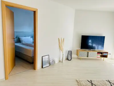 Ein Bett oder Betten in einem Zimmer der Unterkunft Zentrales City Apartment, Penzberg, 2 Schlafzimmer, Balkon, Parkplatz