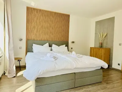 Ein Bett oder Betten in einem Zimmer der Unterkunft Zentrales City Apartment, Penzberg, 2 Schlafzimmer, Balkon, Parkplatz