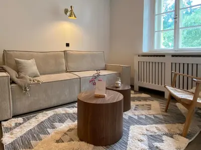 Ein Sitzbereich in der Unterkunft ciao-aschau Haus zur Burg FeWo Bergfest Ap110