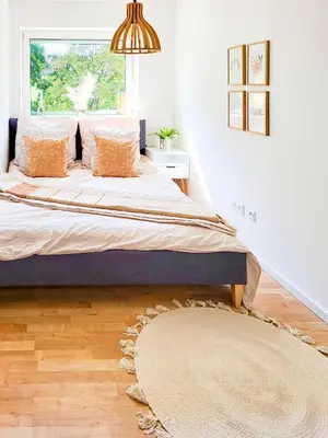 Ein Bett oder Betten in einem Zimmer der Unterkunft Stilvolle 3-Zimmer Wohnung in Ingolstadt mit Balkon und guter Autobahnanbindung
