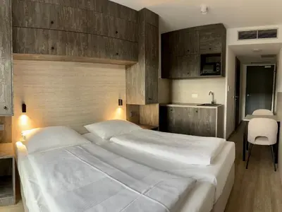 Ein Bett oder Betten in einem Zimmer der Unterkunft Apartimo München-Unterhaching