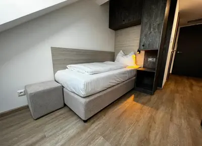 Ein Bett oder Betten in einem Zimmer der Unterkunft Apartimo München-Unterhaching