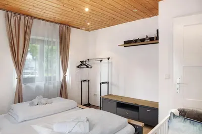 Ein Bett oder Betten in einem Zimmer der Unterkunft Alpina Haus