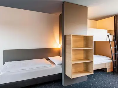 Ein Bett oder Betten in einem Zimmer der Unterkunft B&B Hotel München City-West