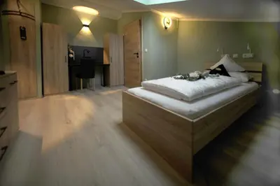 Ein Bett oder Betten in einem Zimmer der Unterkunft Boardinghouse Schongau