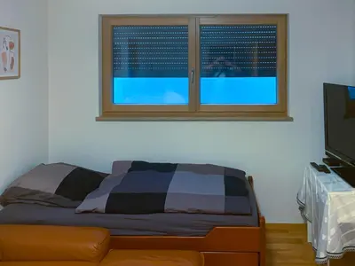 Ein Bett oder Betten in einem Zimmer der Unterkunft Wohnung möbliert, abgeschlossen und verkehrsgünstig gelegen