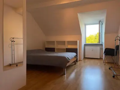 Ein Bett oder Betten in einem Zimmer der Unterkunft Penthouse - Englischer Garten view