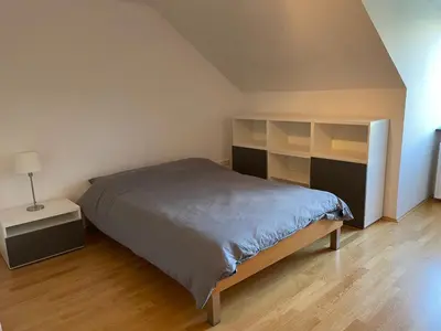 Ein Bett oder Betten in einem Zimmer der Unterkunft Penthouse - Englischer Garten view
