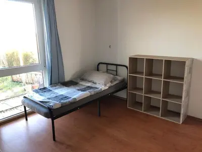 Ein Bett oder Betten in einem Zimmer der Unterkunft Schöne Ferienwohnung im Voralpenland