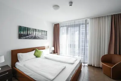 Ein Bett oder Betten in einem Zimmer der Unterkunft Bayer's Boardinghouse und Hotel