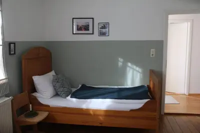 Ein Bett oder Betten in einem Zimmer der Unterkunft KampenZeit Ferienwohnung-traumhafter Panoramablick