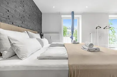 Ein Bett oder Betten in einem Zimmer der Unterkunft PRIME - City Apartment für 6 - Neu & Modern