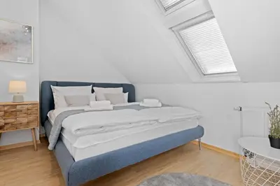 Ein Bett oder Betten in einem Zimmer der Unterkunft Stilvolle Wohnung: Private Dachterrasse - zentral