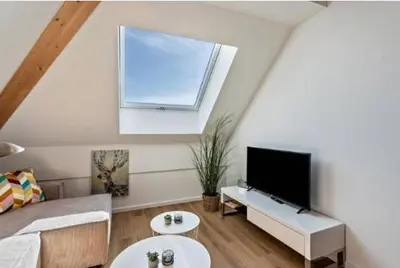 TV/Unterhaltungsangebot in der Unterkunft Terralpin Apartments - Charmante DG Wohnung mit Balkon