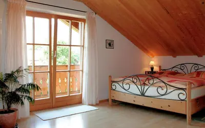 Ein Bett oder Betten in einem Zimmer der Unterkunft Ferienwohnung Goller