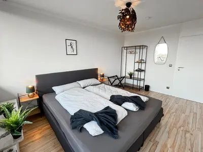 Ein Bett oder Betten in einem Zimmer der Unterkunft LTA Apartment Unterschleißheim bei München - 6P, Parkplatz, S-Bahn