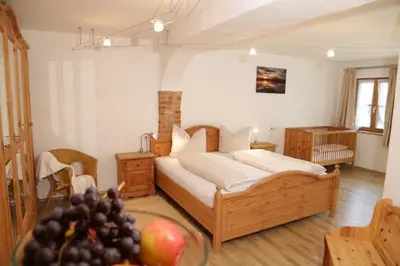 Ein Bett oder Betten in einem Zimmer der Unterkunft Wolfeicherhof