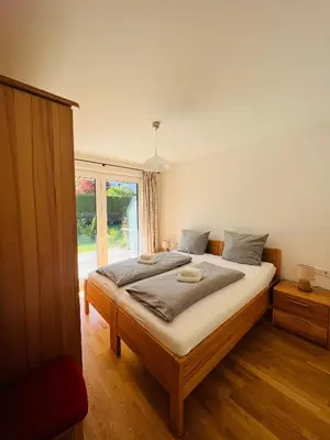 Ein Bett oder Betten in einem Zimmer der Unterkunft Hubertus Terrace&Garden Apartment