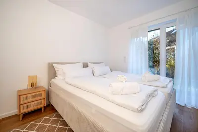 Ein Bett oder Betten in einem Zimmer der Unterkunft LIBORIA I Stylisches Haus I Sauna I Wellness