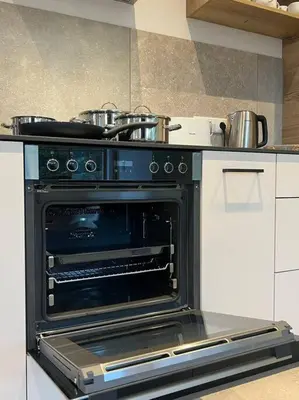 Küche/Küchenzeile in der Unterkunft 4YOUnic Billard * 2 BR * 75-Zoll TV * Boxspringbett