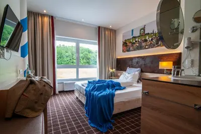 Ein Bett oder Betten in einem Zimmer der Unterkunft Business Class Hotel Ebersberg
