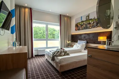 Ein Bett oder Betten in einem Zimmer der Unterkunft Business Class Hotel Ebersberg