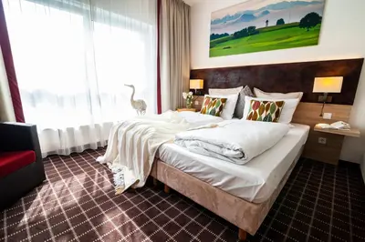 Ein Bett oder Betten in einem Zimmer der Unterkunft Business Class Hotel Ebersberg