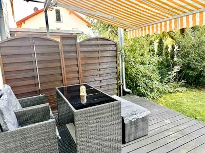 Ein Garten an der Unterkunft Wie Zuhause! Wohnung mit Garten