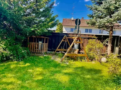 Ein Garten an der Unterkunft Wie Zuhause! Wohnung mit Garten