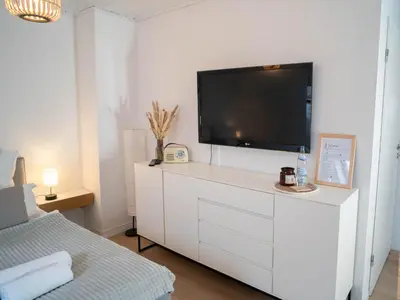 TV/Unterhaltungsangebot in der Unterkunft COZY&RELAX APARTMENT-Balkon Küche Parkplatz WIFI Netflix