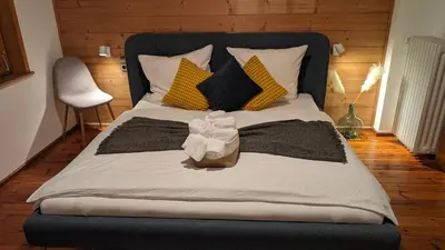 Ein Bett oder Betten in einem Zimmer der Unterkunft Einzigartiges Berg-Chalet in Alleinlage bis zu 21 Personen