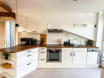 Küche/Küchenzeile in der Unterkunft Loft-Wohnung im Herzen von Prien - 100m2 - SmartTV