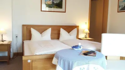 Ein Bett oder Betten in einem Zimmer der Unterkunft Gästehaus Attenhauser