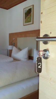 Ein Bett oder Betten in einem Zimmer der Unterkunft Gästehaus Attenhauser
