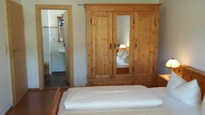 Ein Bett oder Betten in einem Zimmer der Unterkunft Gästehaus Attenhauser
