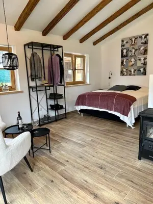 Ein Bett oder Betten in einem Zimmer der Unterkunft DIE ZWEI CHALETS AM TEGERNSEE 
