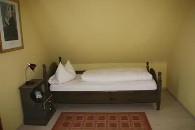 Ein Bett oder Betten in einem Zimmer der Unterkunft Hotel Gasthaus Wangerhof